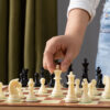 Premium Custom Wooden Chess Printing for Authors and Wholesale Strategy Enthusiasts Majestic custom wooden chess printing by ABPro Print, showcasing inlaid pawns and kings for immersive tactical conquests