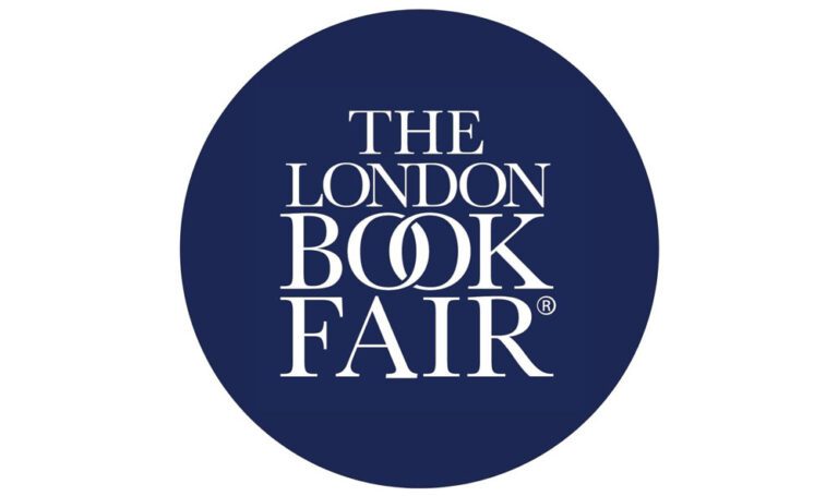 Author at 2025 London Book Fair discussing custom children’s book printing with ABP Print for vibrant, unique books.